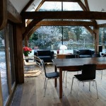 An air dried oak frame extension in an open living room with many light.