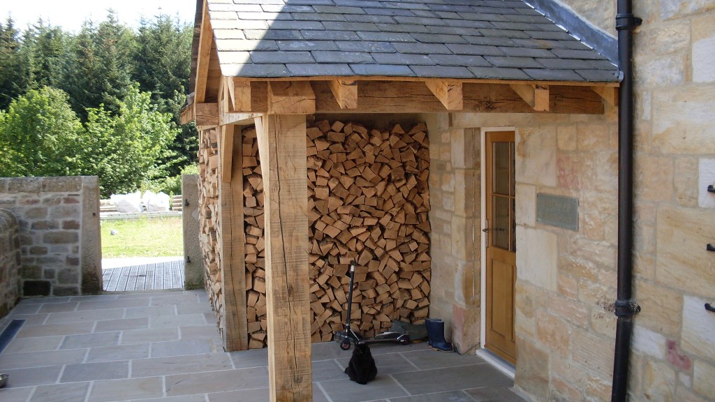 Porch/log store.