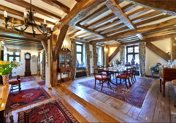 Framed oak dinning room with wooden floor and furniture.