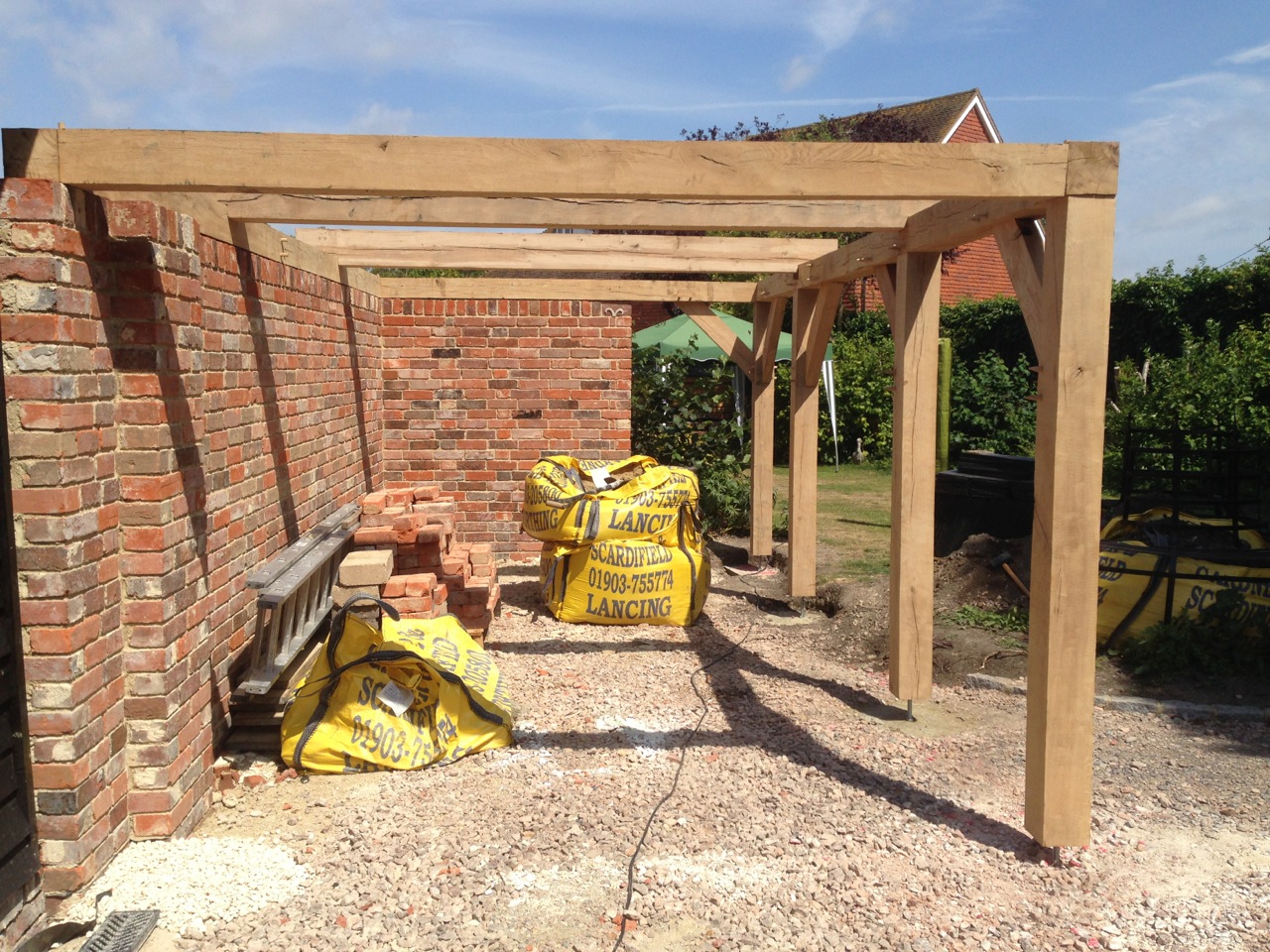 Oak framed carport in construction.