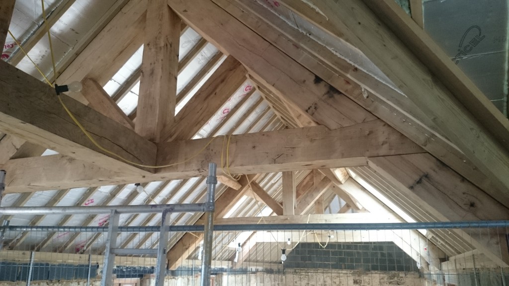 Finished large raised collar oak trusses.