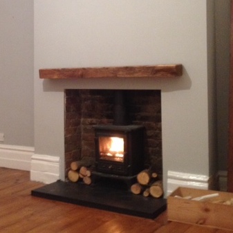 Oak beam fireplace: mantel ideas and maintenance
