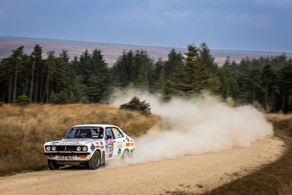 Tradoak.com rally car driving through dirt road