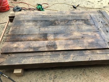 A reclaimed oak door which is being restored.