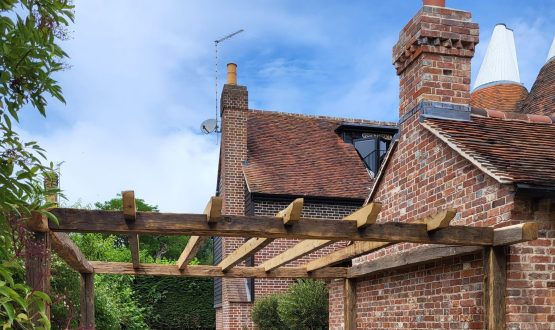 Outdoor furniture over a wooden pergola