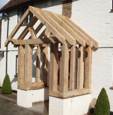 An oak beam framed porch from the right.