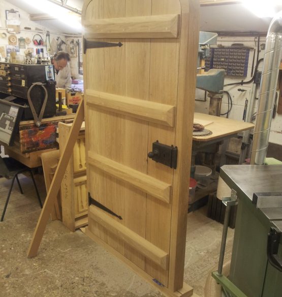 A solid oak door being created in our workshop