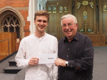 Leo Popplewell receives his cheque from main sponsor Neil Peskett of Tradoak