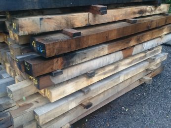 Reclaimed oak beams in the yard