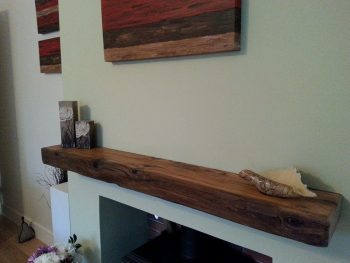 Floating oak beam over a fireplace.