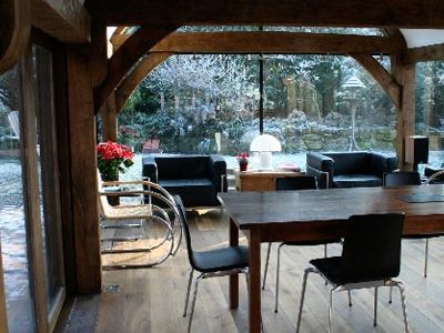 An air dried oak frame extension in an open living room with many light.