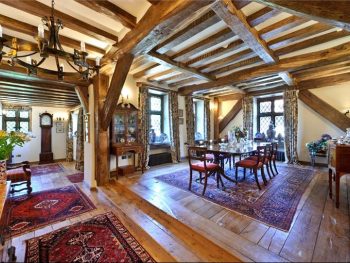 Framed oak dinning room with wooden floor and furniture.