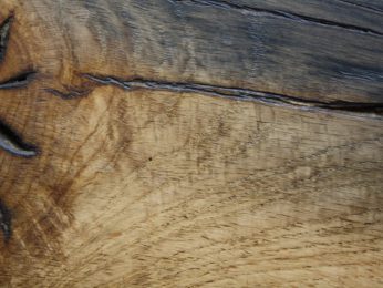 Reclaimed oak that has been sawn, sanded and waxed finish