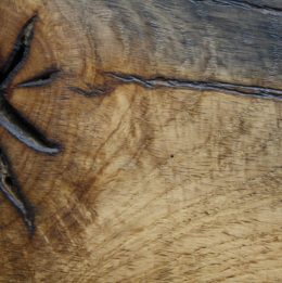 Reclaimed oak that has been sawn, sanded and waxed finish